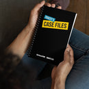 A person holds a black spiral notebook titled 'TRACEY'S CASE FILES' in bold lettering, with 'Tracey's' in cyan blue and 'Case Files' in yellow, set at an angle. 'SiriusXM' and 'SmartLess' logos appear at the bottom of the cover.