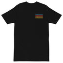 Flat lay of a black unisex T-shirt with a small graphic on the left chest. The design features the words 'SEXY INDIFFERENCE' repeated four times in stacked rows, each in a different color: blue, red, orange, and yellow.