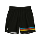 A flat lay of black swim trunks with blue, red, orange, and yellow stripes running horizontally across the lower right leg, each with the phrase 'SEXY INDIFFERENCE' in black. A white 'SiriusXM' logo is printed near the lower left hem.