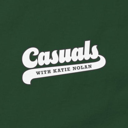Close up of the front side white 'Casuals WITH KATIE NOLAN' logo in retro font.