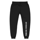 Flat lay of black sweatpants with a drawstring waist. The left leg features vertical white text reading 'PROMO CODE: STAYING ALIVE'.