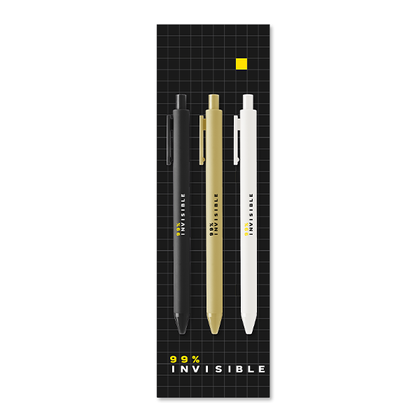 A set of three pens—black, gold, and white—arranged vertically on black grid-patterned packaging, labeled ‘99% Invisible’ in white and yellow text at the bottom.