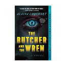 Front cover of the novel ‘THE BUTCHER AND THE WREN’ by ‘ALAINA URQUHART’. A dark, shadowed face fills the cover, focused on a single blue-green eye with the silhouette of a man standing inside the pupil. Large yellow title text reads ‘THE BUTCHER AND THE WREN’, with ‘A NOVEL’ below. A badge reads ‘GOOD MORBID! WITH ALAINA URQUHART PODCAST’, and a vertical teal strip on the right says ‘NEW YORK TIMES BESTSELLER’.