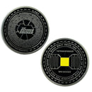 Front and back of black coin featuring 'THE POWER BROKER,' with intricate designs on one side and a central yellow square with text that reads 'THE POWER BROKER,' '99% INVISIBLE,' and 'ONE MUST WAIT UNTIL THE EVENING TO SEE HOW SPLENDID THE DAY HAS BEEN' on the other side