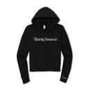 Front product view of a black cropped hoodie with bold white gothic blackletter text reading ‘Weirdly Immortal’ across the chest. Features a drawstring hood, cropped silhouette, long sleeves, ribbed cuffs and hem, and a small print near the wearer’s left cuff reading ‘MORBID Live’.