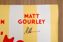 Close-up of the 'Matt Gourley' section of the 'Summer S’mores with Conan & The Chill Chums' poster, showing his name printed in red and his signature in black on a yellow stripe.