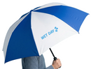 Open umbrella with alternating blue and white panels. One white panel features light blue text reading ‘WET DAY’ with a splash icon. A person holds the black handle, showing scale and use in rainy conditions.