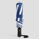 Foldable umbrella with blue and white striped canopy on a light gray background