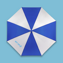 Open umbrella shown from above, displaying a symmetrical radial pattern of alternating blue and white triangular panels forming a pinwheel effect. On one white panel, light blue text reads ‘WET DAY’ followed by a small splash icon. The canopy is fully extended, with a central hub and evenly spaced ribs creating a clean, geometric layout against a light blue background.