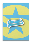 Rectangular enamel pin with rounded edges, showing light blue script text 'Casuals' above smaller yellow text 'With Katie Nolan' on a matching blue underline, outlined in white metal trim, displayed on a backing card printed with a large yellow SiriusXM 'S-Star' logo on a blue background.