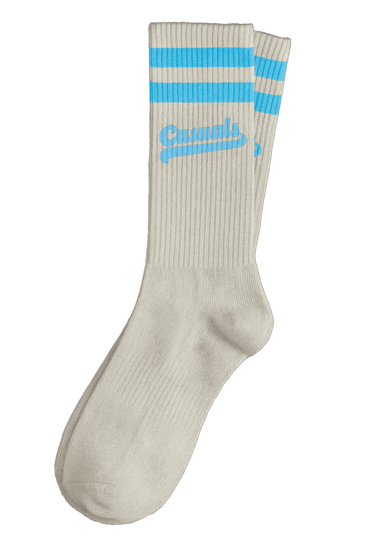 Cream ribbed crew socks with two sky-blue stripes at the cuff and the word 'Casuals' printed in blue script across the ribbed cuff.