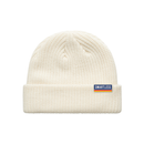 Cream-colored knit beanie featuring a small blue woven tag that reads ‘SMARTLESS’ with a yellow stripe underneath.