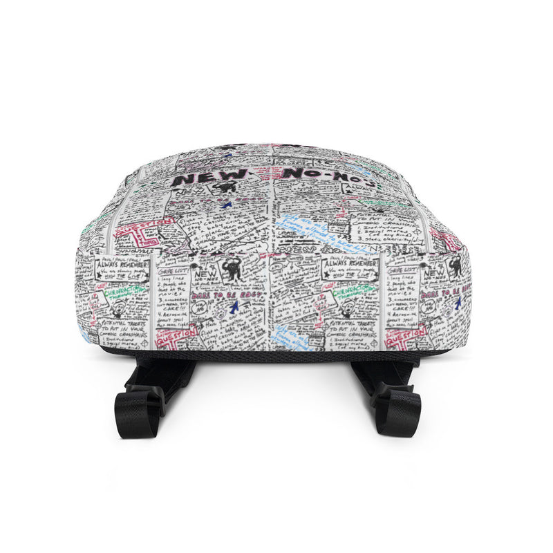 Underside of backpack covered in handwritten notes and doodles in various colors on a white background.