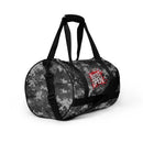 Camouflage duffel bag with 'Busted Open' logo in red on the side.