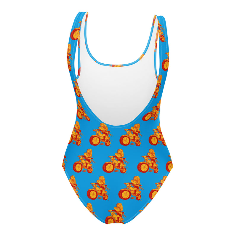 Colorful one-piece swimsuit featuring Comedy Bang! Bang! logo with vibrant orange and yellow bicycle patterns on a blue background.