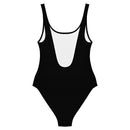 A black one-piece swimsuit displayed from the back, featuring a low scoop cut and white interior lining.