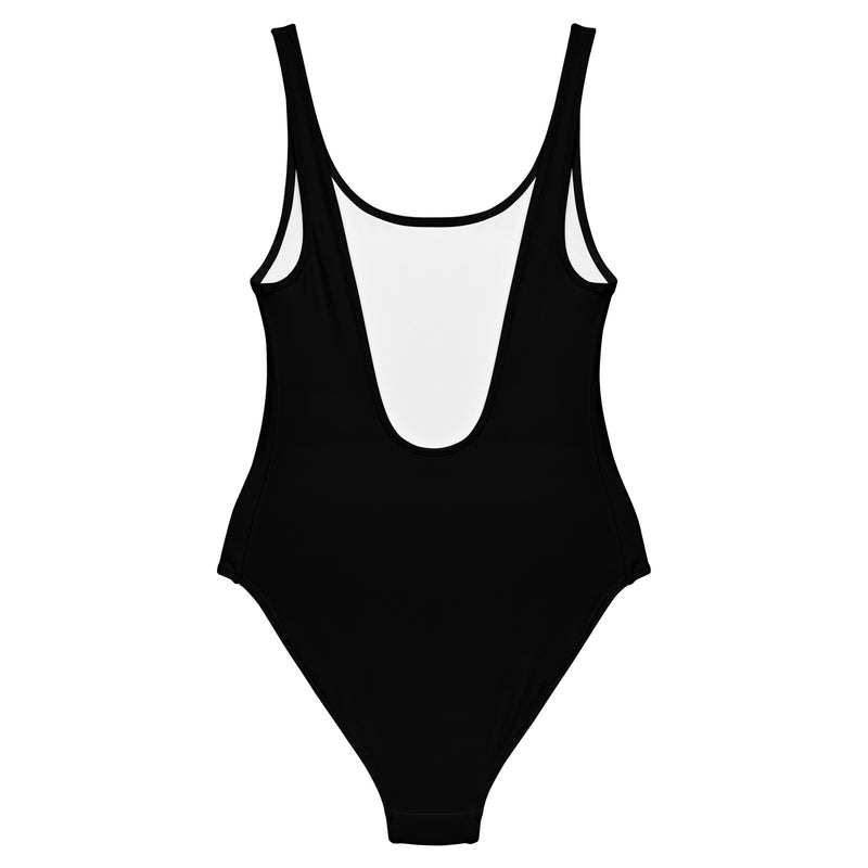 A black one-piece swimsuit displayed from the back, featuring a low scoop cut and white interior lining.