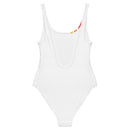 A white one-piece swimsuit shown flat from the back, featuring a low scoop back and a small portion of the colored stripes just visible at the neckline.