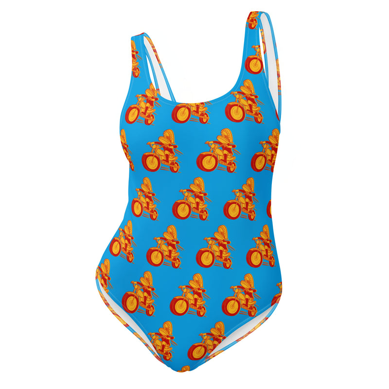 Colorful one-piece swimsuit featuring Comedy Bang! Bang! logo with vibrant orange and yellow bicycle patterns on a blue background.