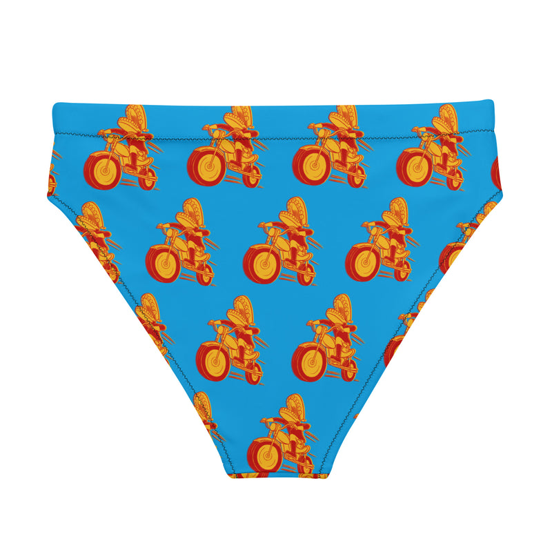 A flat lay of a blue high-waisted bikini bottom with a repeating pattern of a red and yellow cartoon character riding a motorcycle, shown from the back.