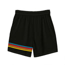 A flat lay of the back of a pair of black swim trunks featuring four clean, horizontal stripes in blue, red, orange, and yellow running across the lower left leg.