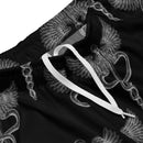 Close-up of the waistband of black mesh shorts with a white drawstring. The fabric features a repeating gray caduceus design—a winged staff with two snakes wrapped around it, symbolizing medicine and healing.