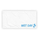Wide flat view of a white towel with gentle wrinkles and a small ‘WET DAY’ blue text and splash graphic placed in the lower right corner. The image focuses on overall size, clean layout, and print placement.