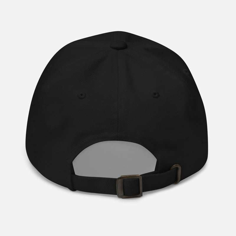  A black classic dad hat viewed from the back, featuring an adjustable brass buckle strap.