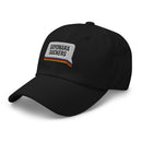 Side view of a black dad hat showing the white embroidered 'SAYONARA SUCKERS' patch with red, orange, blue, and yellow stripes along the base of the speech bubble.