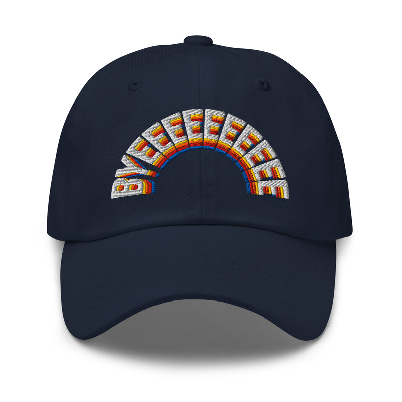A navy blue dad hat with the word 'BYEEEEEEEE' embroidered in a rainbow arc across the front, featuring bold letters in white, yellow, red, orange, and blue thread.