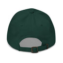 Back view of a dark green spruce-colored dad hat. The cap has a soft, unstructured crown with stitched eyelets and a fabric-covered top button. An adjustable fabric strap runs through a brushed brass buckle closure at the back. No graphics or text are visible on the back.