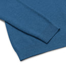 Close up of blue ribbed cuffs and hem of blue sweater.