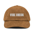 Cap in brown corduroy with the text 'VIBE CHECK' embroidered in white.