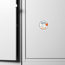 Sticker on a white cabinet door featuring a handshake and text indicating official friendship with Conan O'Brien.