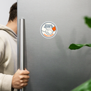 person reaching for a stainless steel refrigerator with a sticker that reads official friend of Conan O'Brien