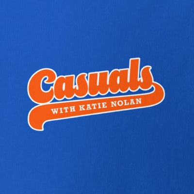 Close up of the front side orange and white 'Casuals WITH KATIE NOLAN' logo in retro font.