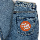 denim jeans with 'Team Coco' logo patch on the back pocket