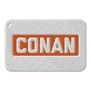Embroidered patch featuring the text 'CONAN' in white and orange on a textured white background.