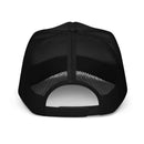 Back view of a black foam trucker hat showing the mesh back panels and an adjustable plastic snap closure.