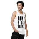 Man wearing a white tank top with bold black text that reads 'DUMB BITCH SUMMER' in three stacked lines; he is looking down and to the side with one hand in his pocket.