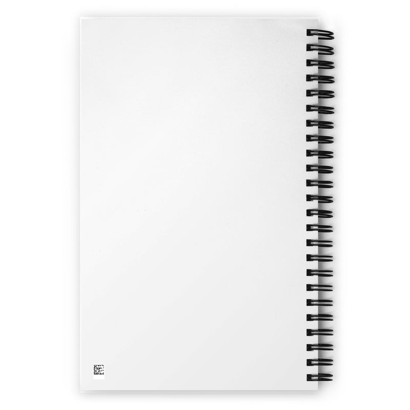Back cover of a white spiral notebook resting on white surface, the black wire binding is visible on the right.