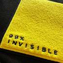 Yellow chanille patch with black text reading 98% INVISIBLE on a black background