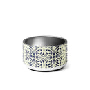 Ceramic pet bowl featuring a decorative design and the logo 'TEAMCOCO' in bold letters