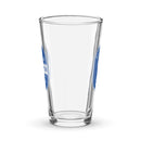Side view of clear pint glass partially showing front and back designs. 