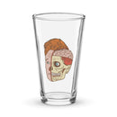 Glass pint glass featuring a split illustration of a human head showing both a brain and a skull design.