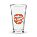 Clear glass pint glass with 'Team Coco Podcasts' logo in orange and white