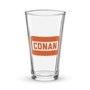 Clear glass pint glass with an orange 'CONAN' logo on the front