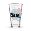 pint glass featuring "CBB15" and the phrase "Fifteen Years of an Open-Door Policy" with graphic design elements