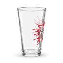 Pint glass with red splatter design featuring the 'BUSTED OPEN' logo.