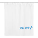 White shower curtain hanging from a rod with evenly spaced hooks. In the lower right corner, light blue ‘WET DAY’ text and splash icon are printed. The rest of the curtain is plain, emphasizing a clean, minimal design.